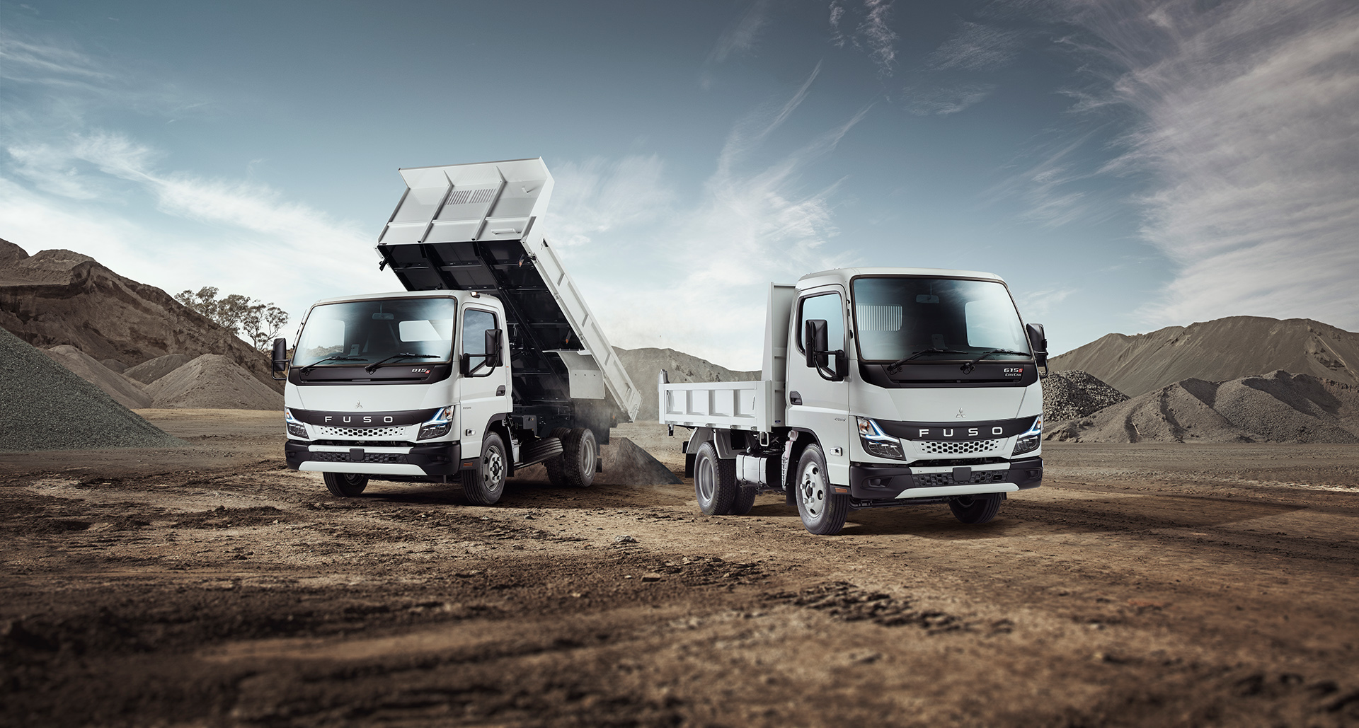 Retouched image of Fuso Canter trucks in a quarry